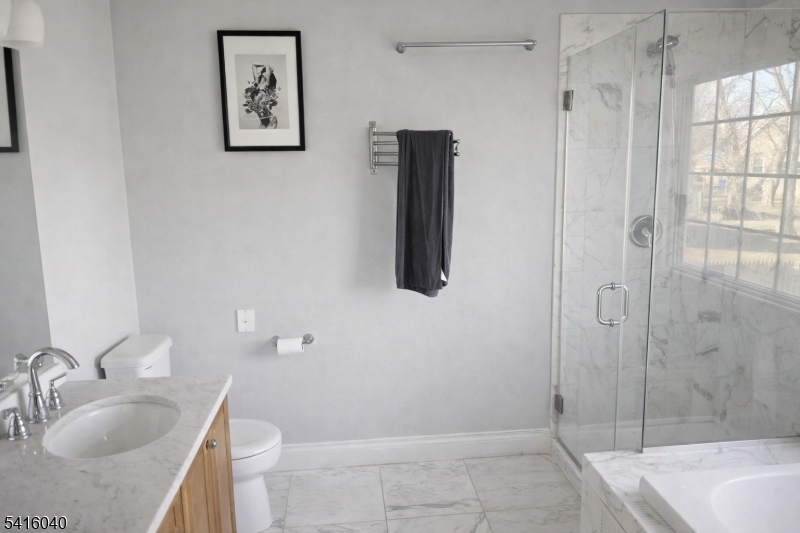 812 Old York Road Raritan, NJ 08869 - Photo 10 of 16 a bathroom with a granite countertop sink a toilet and shower