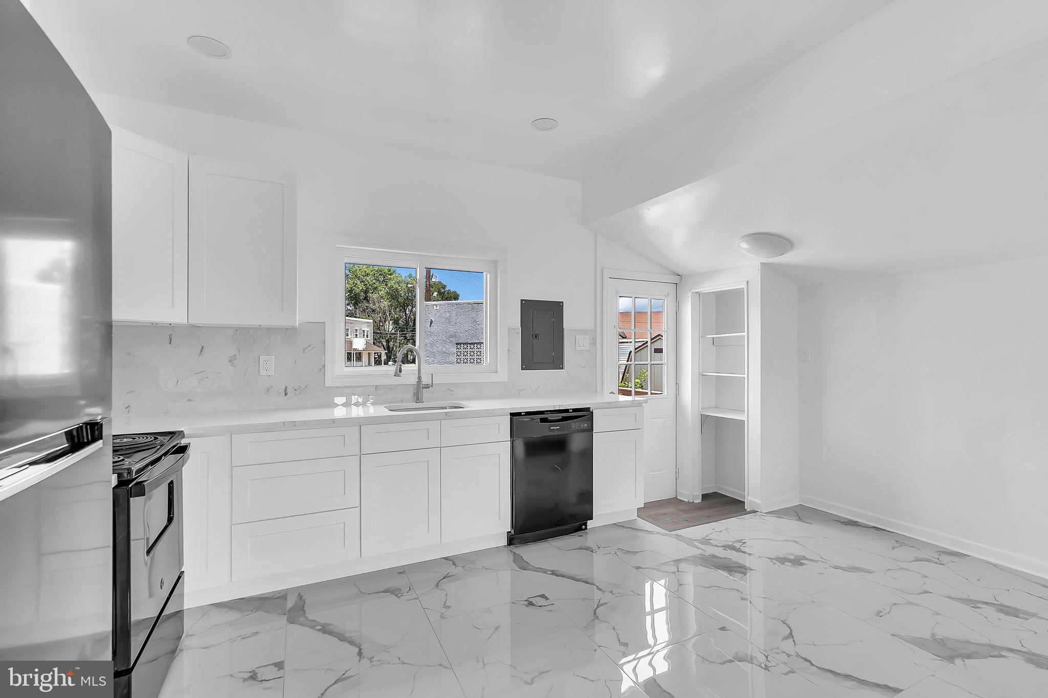 264 Birch Street Carneys Point, NJ 08069 - Photo 10 of 29 Sleek, modern kitchen with marble floors.