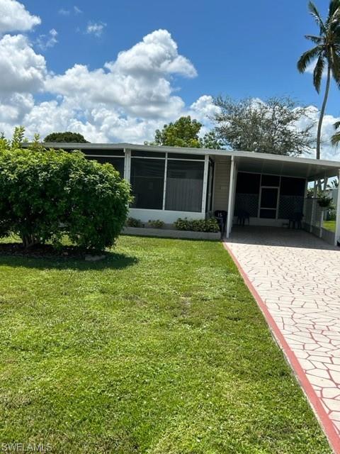 a view of a backyard with plants and a patio