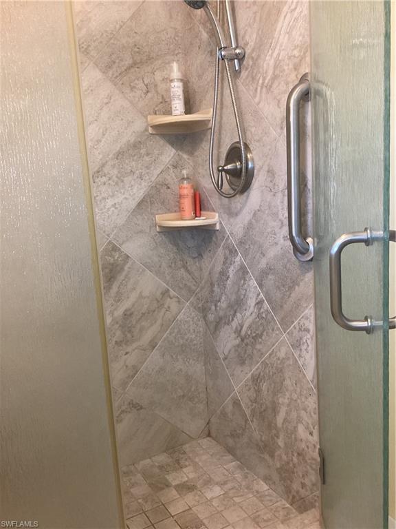 15 Cannes Drive Naples, FL 34112 - Photo 17 of 33 a bathroom with a shower