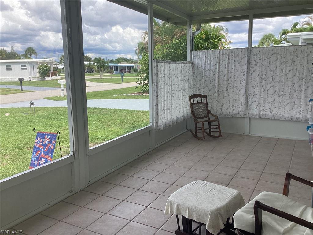 15 Cannes Drive Naples, FL 34112 - Photo 20 of 33 a view of a chairs and table in patio