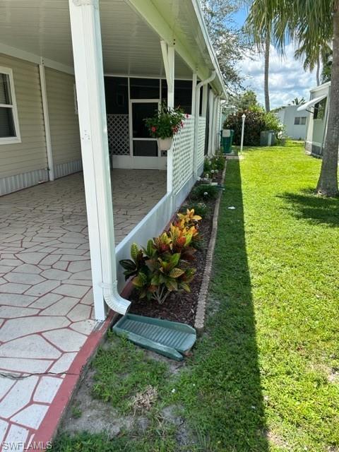 15 Cannes Drive Naples, FL 34112 - Photo 2 of 33 a view of a backyard with plants