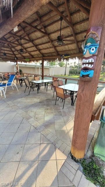 15 Cannes Drive Naples, FL 34112 - Photo 25 of 33 a view of a chairs and tables in patio