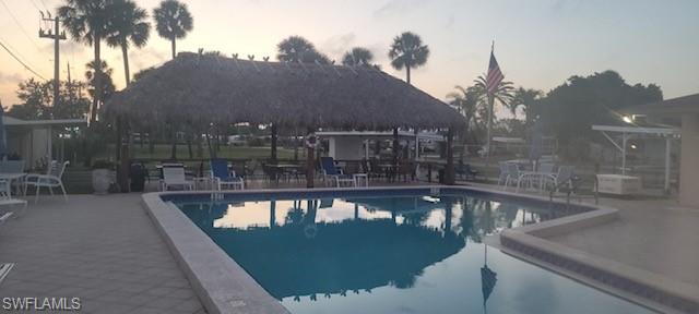 15 Cannes Drive Naples, FL 34112 - Photo 27 of 33 a view of a swimming pool from a balcony