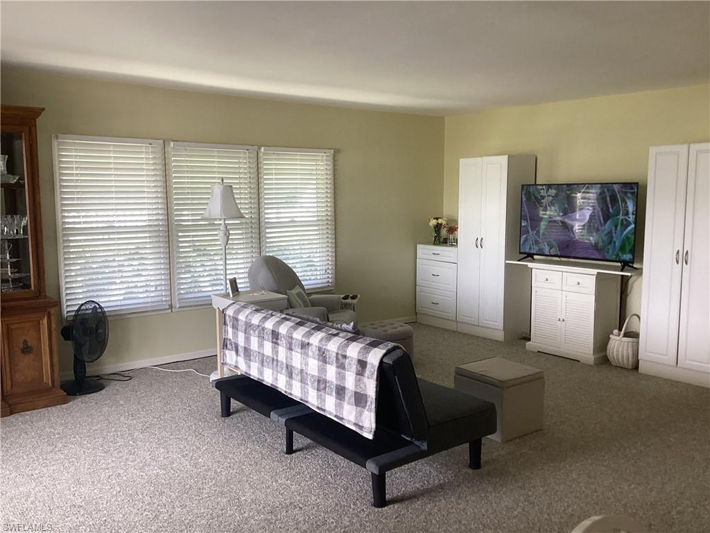 15 Cannes Drive Naples, FL 34112 - Photo 5 of 33 a bedroom with furniture and a window