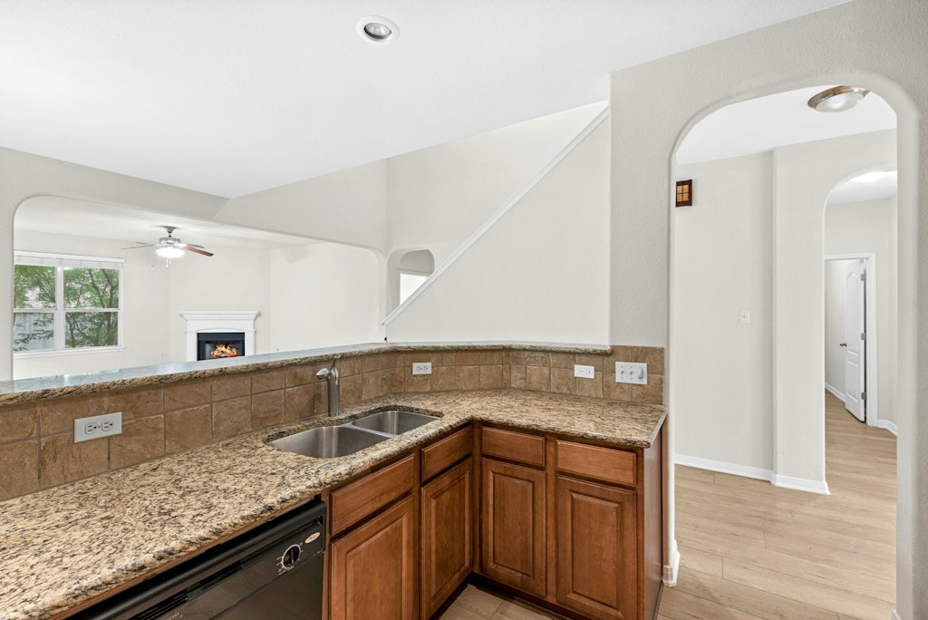 903 Fork Ridge Path Round Rock, TX 78665 - Photo 11 of 35 a kitchen with granite countertop a sink and cabinets
