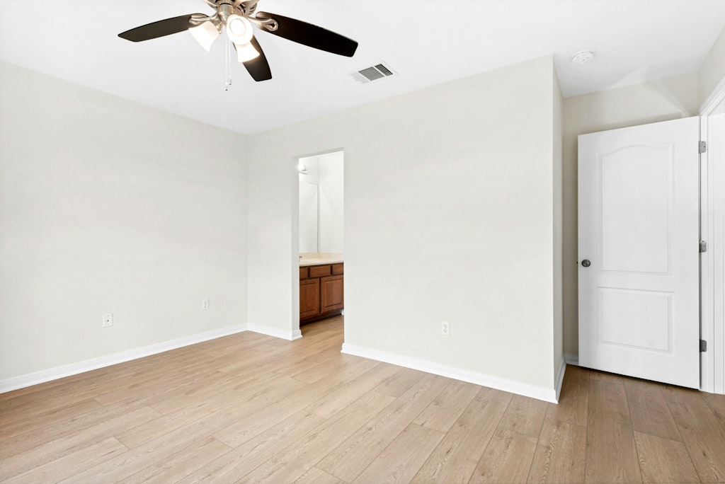 903 Fork Ridge Path Round Rock, TX 78665 - Photo 19 of 35 a view of an empty room with wooden floor