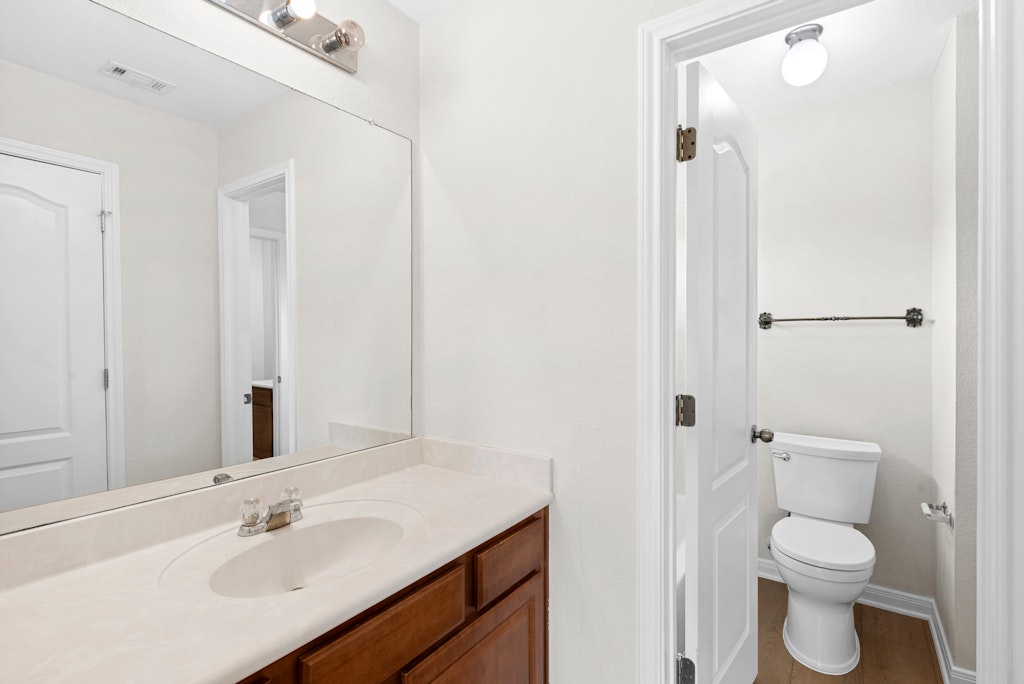 903 Fork Ridge Path Round Rock, TX 78665 - Photo 20 of 35 a bathroom with a sink toilet and shower
