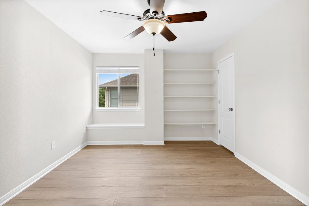 903 Fork Ridge Path Round Rock, TX 78665 - Photo 26 of 35 an empty room with a empty space and a ceiling fan