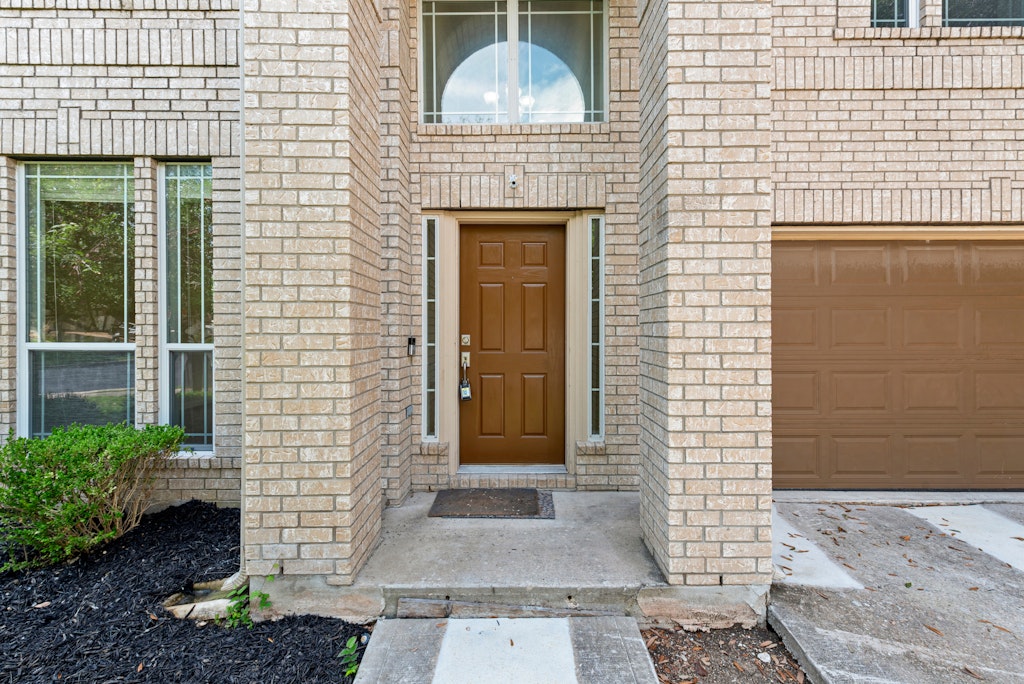 903 Fork Ridge Path Round Rock, TX 78665 - Photo 3 of 35 a front view of a house with a garden