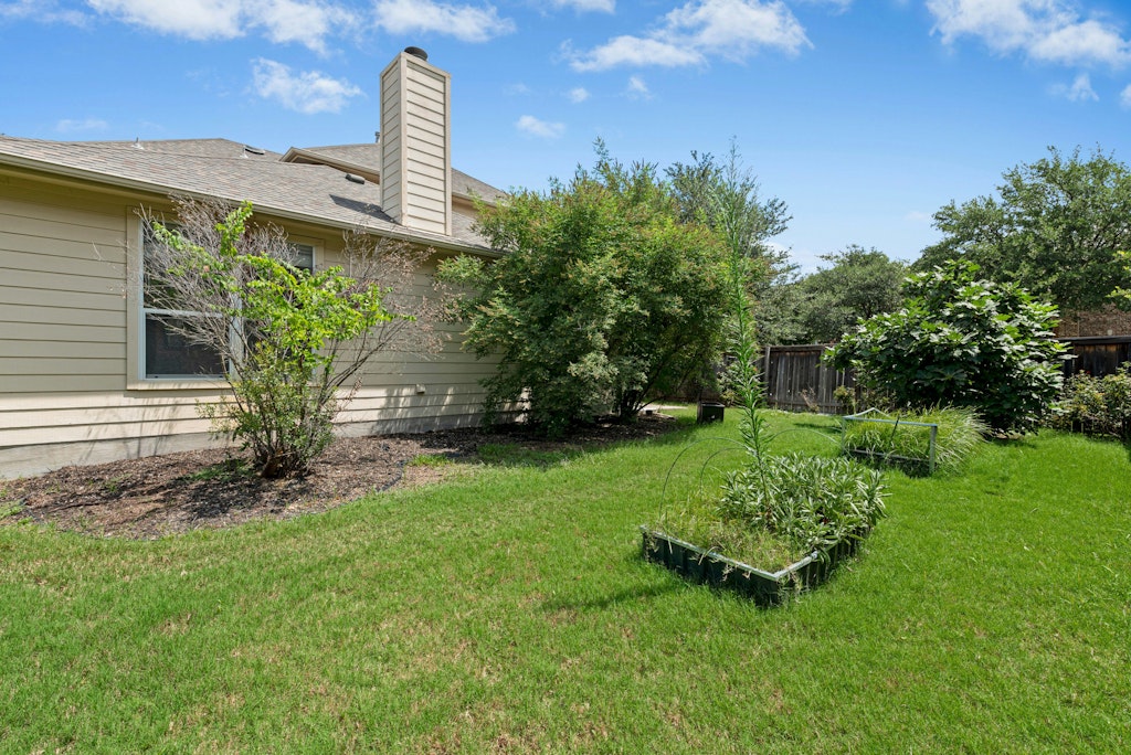 903 Fork Ridge Path Round Rock, TX 78665 - Photo 35 of 35 a front view of a house with garden