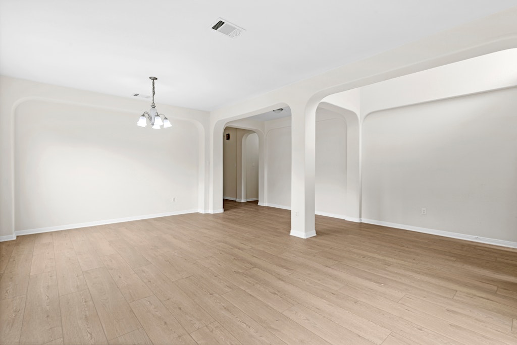 903 Fork Ridge Path Round Rock, TX 78665 - Photo 6 of 35 a view of an empty room with wooden floor