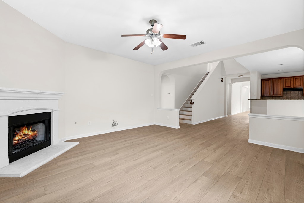 903 Fork Ridge Path Round Rock, TX 78665 - Photo 9 of 35 a view of an empty room with wooden floor fireplace and a window