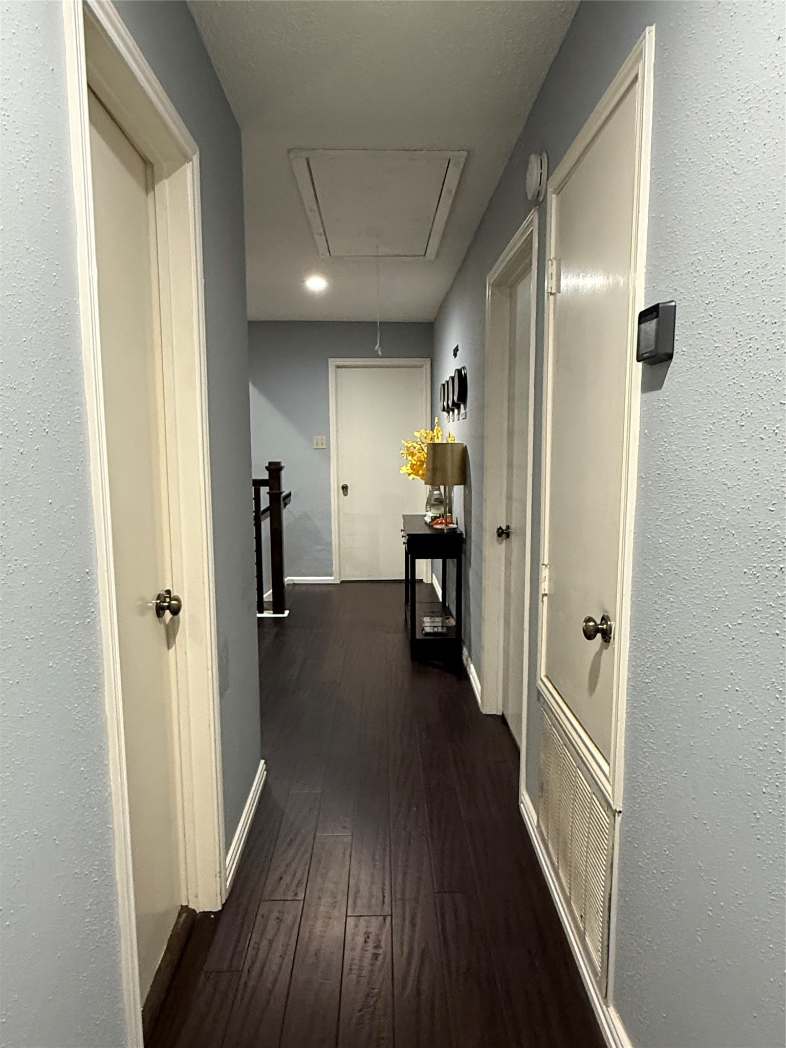 4211 Bridledon Lane Houston, TX 77014 - Photo 13 of 17 a view of hallway with wooden floor
