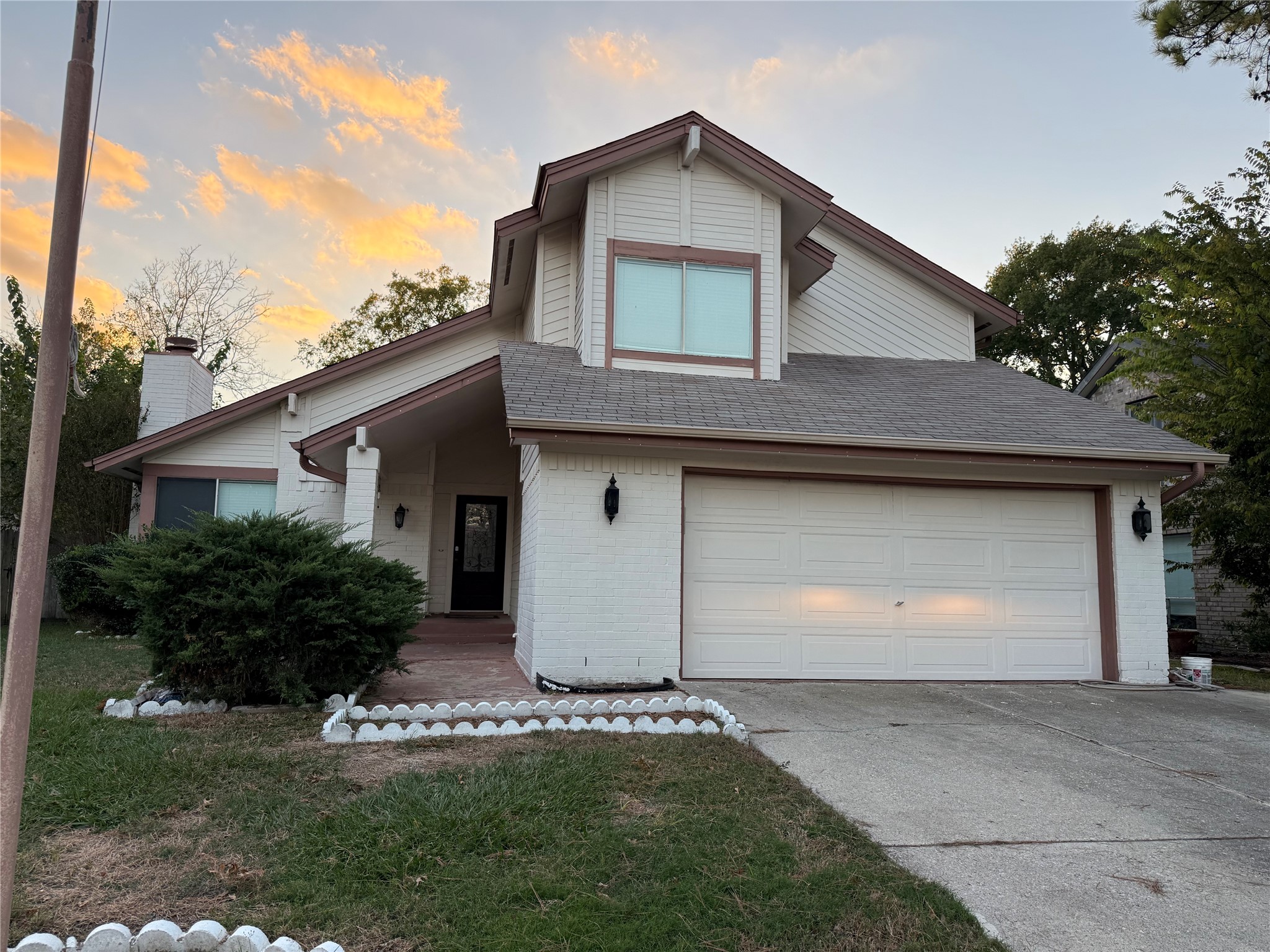 4211 Bridledon Lane Houston, TX 77014 - Photo 17 of 17 a front view of a house with a yard and garage