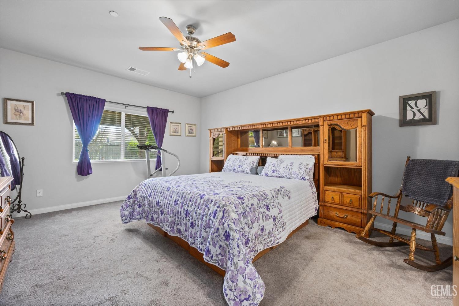 Undisclosed Address Bakersfield, CA 93313 - Photo 11 of 24 a bed room with a bed and painting on the wall