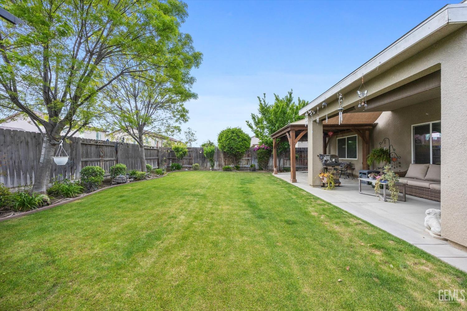 Undisclosed Address Bakersfield, CA 93313 - Photo 22 of 24 a view of outdoor space yard deck and patio