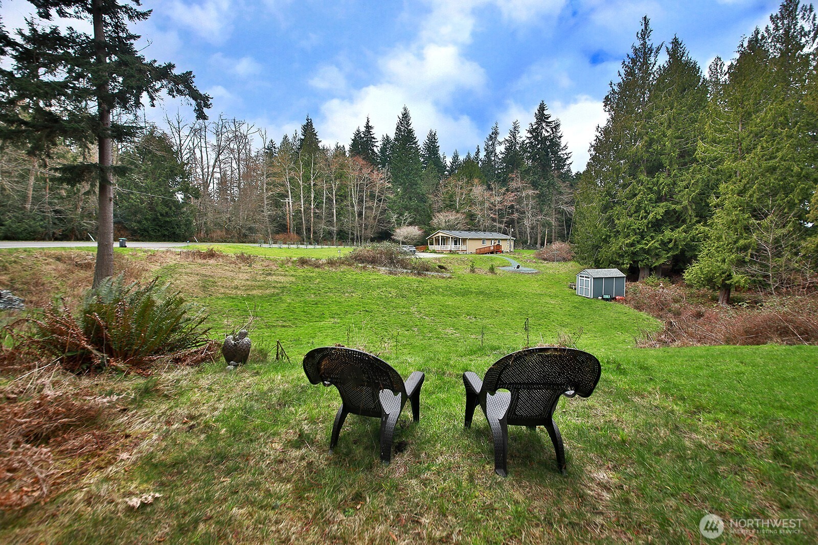 4985 Wilkinson Road Langley, WA 98260 - Photo 9 of 14 a view of a table and chairs in the garden