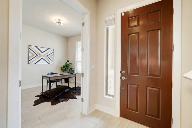 a view of a livingroom with furniture and front door