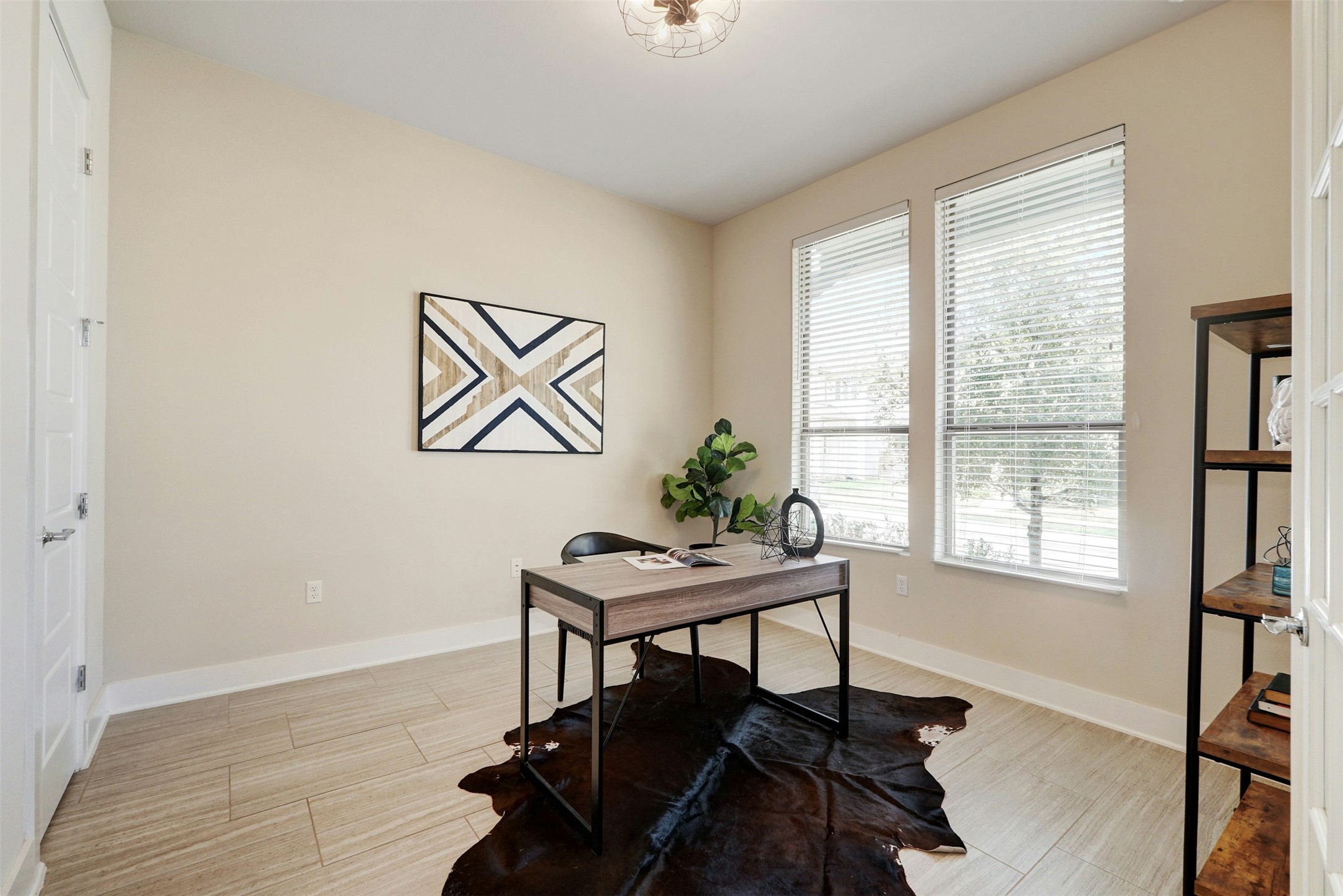 1603 Arcilla Street Austin, TX 78741 - Photo 19 of 36 a view of a workspace with furniture and a window