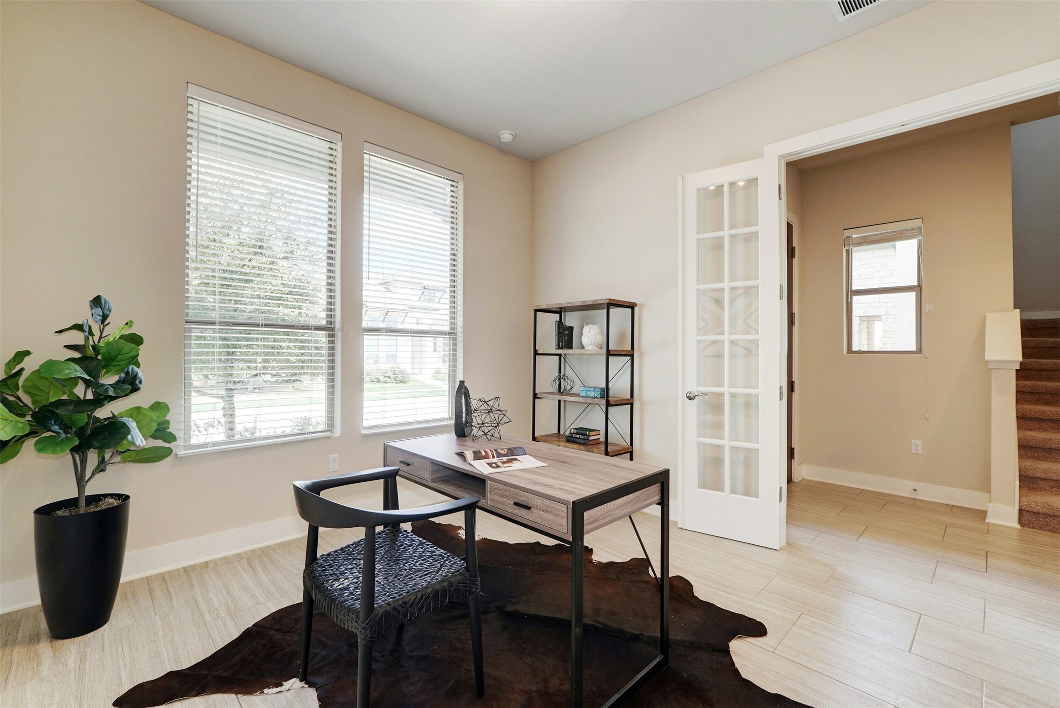 1603 Arcilla Street Austin, TX 78741 - Photo 20 of 36 a view of a dining room with furniture and a potted plant