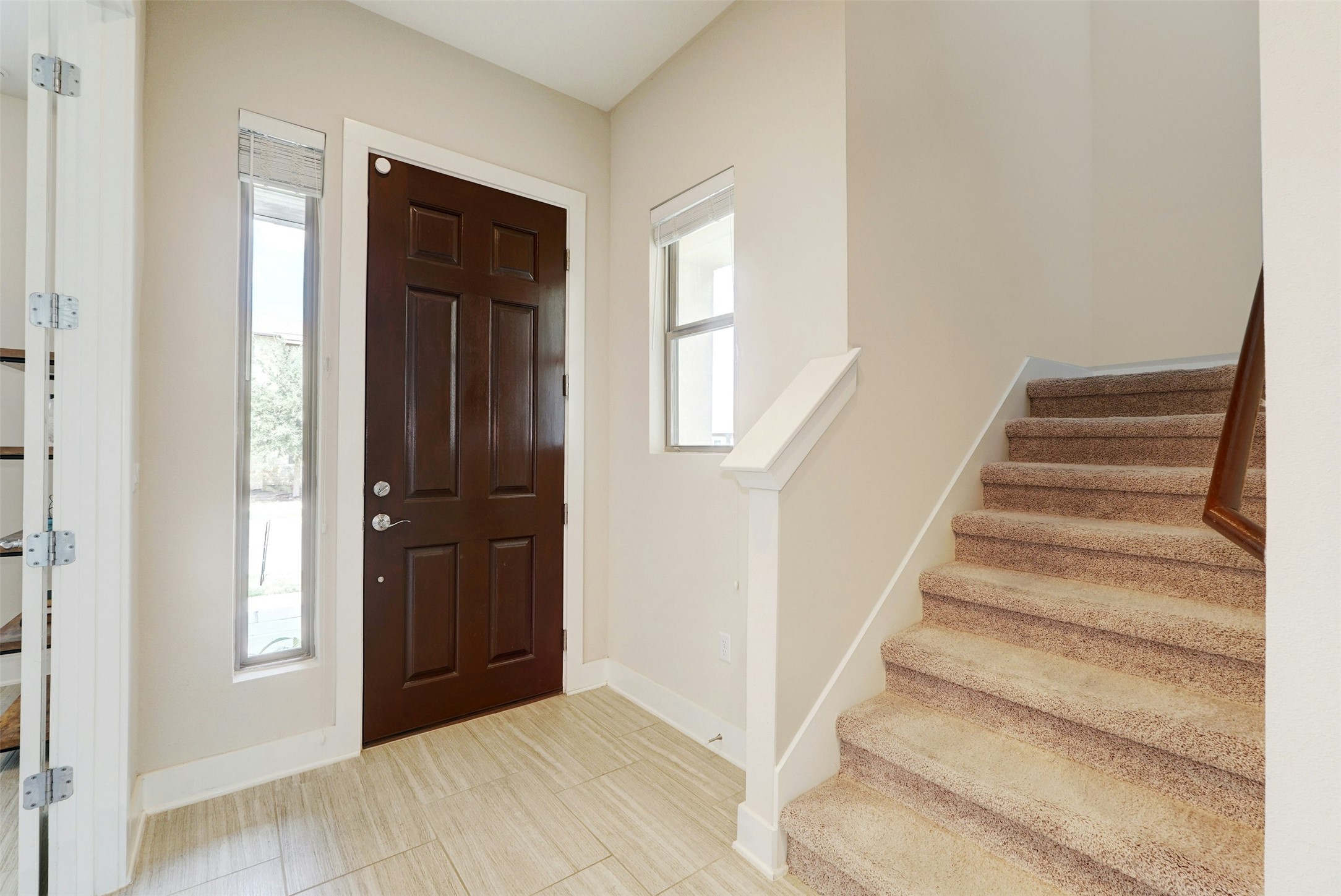 1603 Arcilla Street Austin, TX 78741 - Photo 21 of 36 a view of an entryway with wooden floor and door