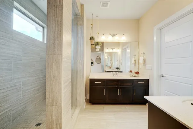 a bathroom with a double vanity sink mirror and double