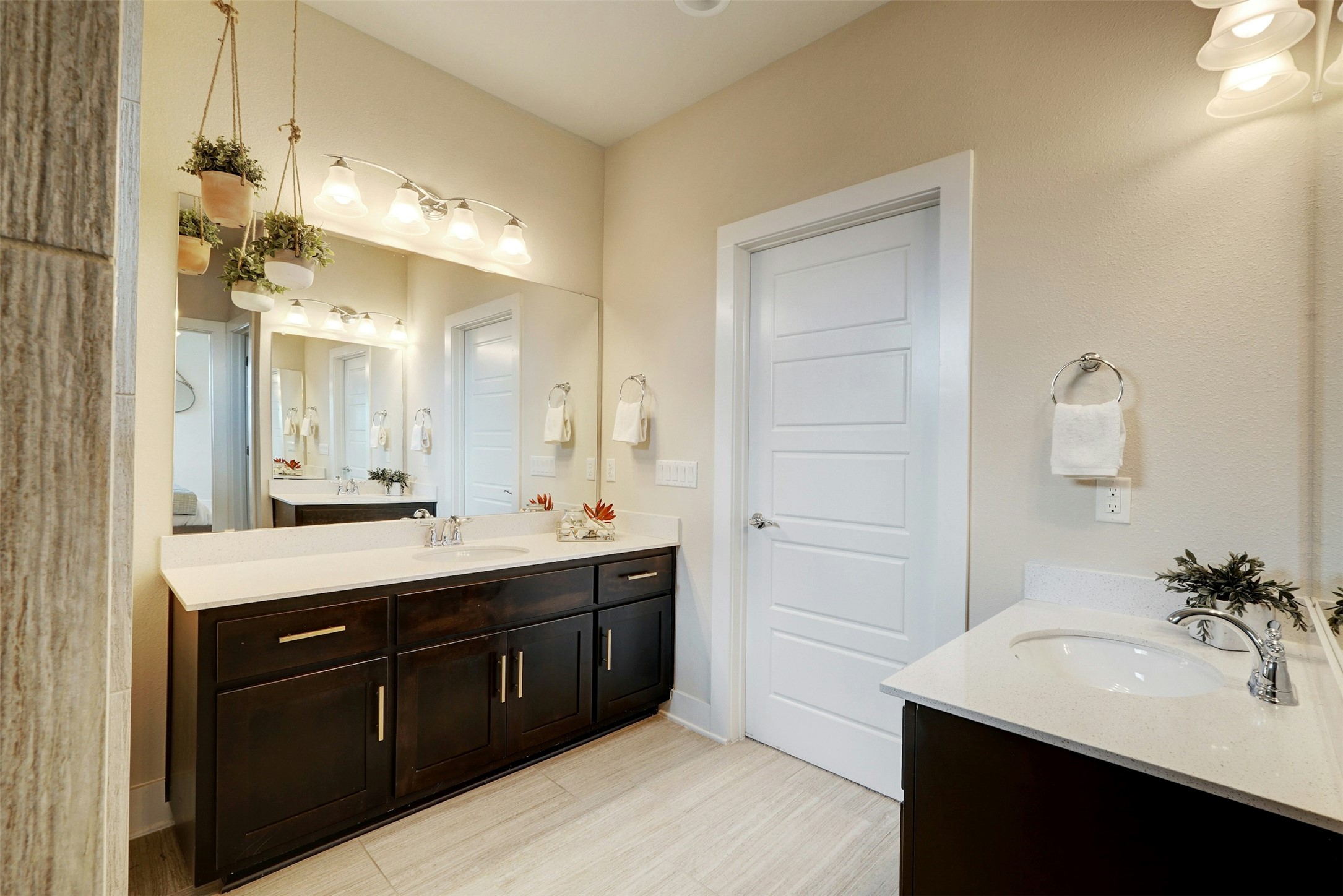 1603 Arcilla Street Austin, TX 78741 - Photo 25 of 36 a spacious bathroom with a double vanity sink a mirror and a bathtub
