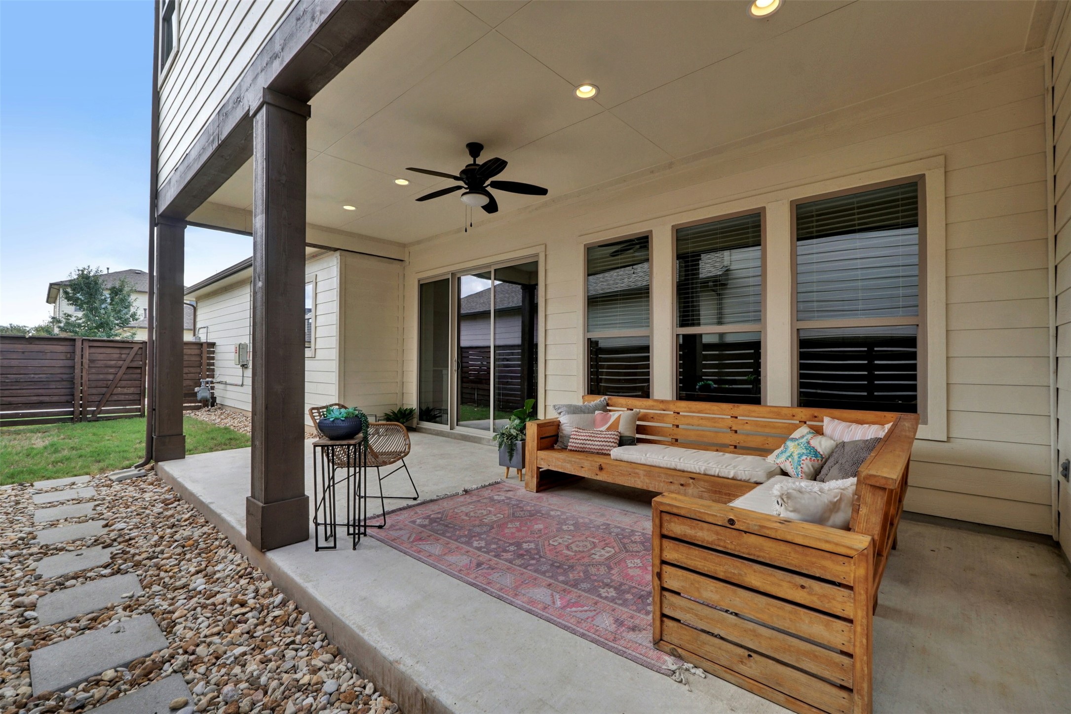 1603 Arcilla Street Austin, TX 78741 - Photo 35 of 36 a living room with furniture and a floor to ceiling window
