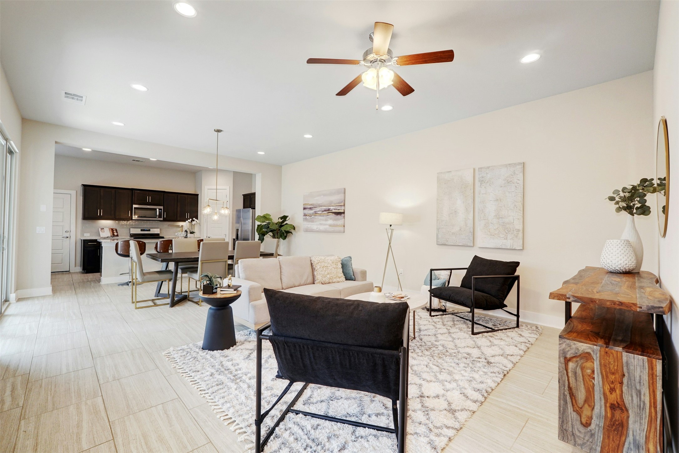 1603 Arcilla Street Austin, TX 78741 - Photo 4 of 36 a living room with furniture kitchen view and a wooden floor