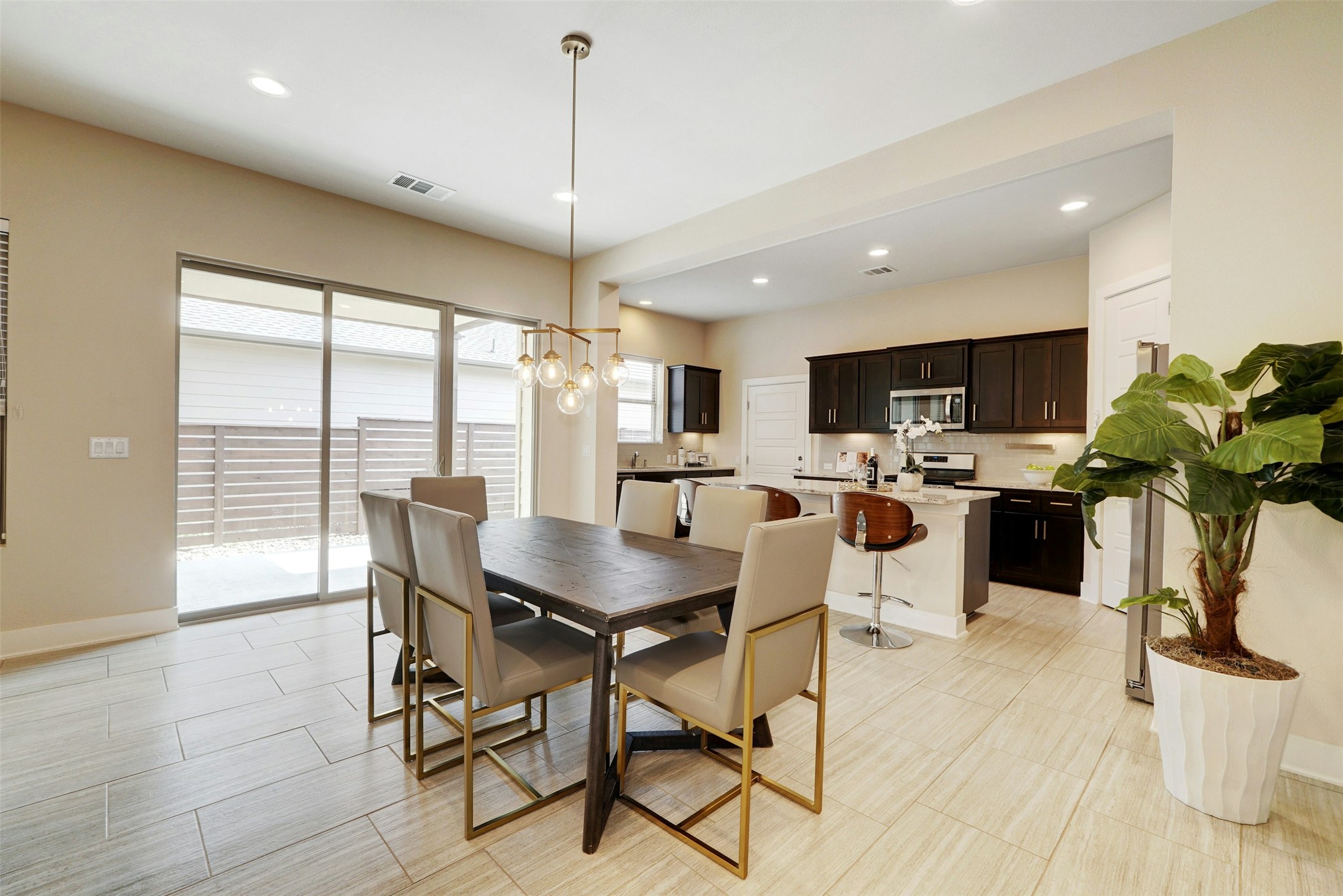 1603 Arcilla Street Austin, TX 78741 - Photo 8 of 36 a view of a dining room with furniture window and wooden floor