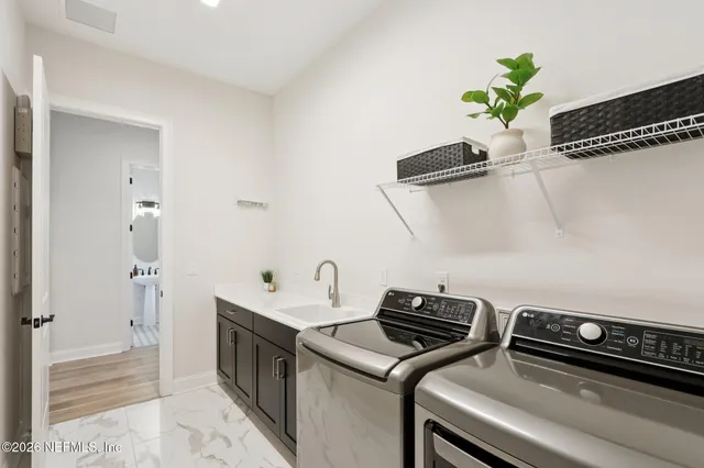 a bathroom with a double vanity sink a mirror and shower