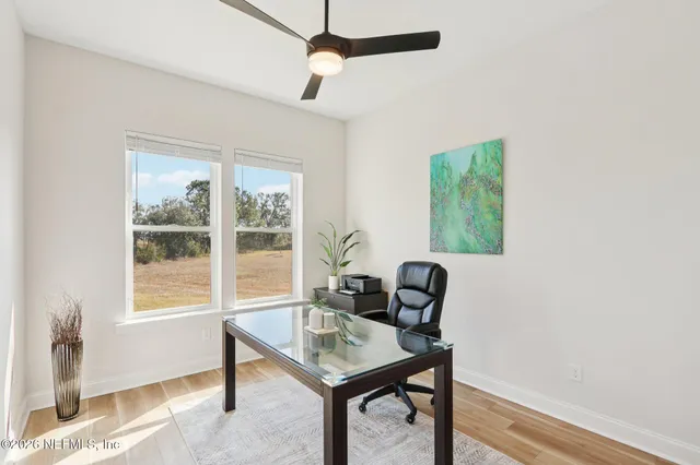 a view of swimming pool with outdoor seating and plants