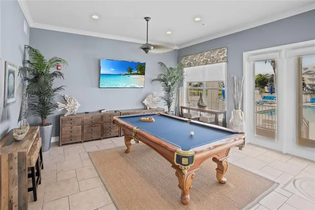 a view of a house with pool table and chairs