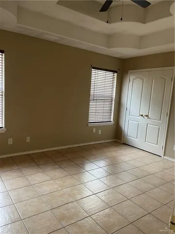 a view of an empty room and a window