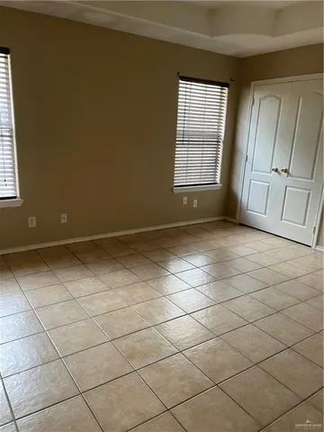 a view of an empty room and a window