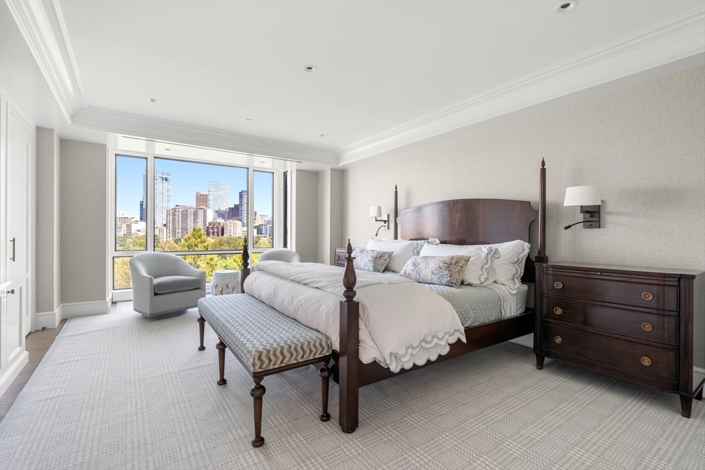 2 Commonwealth Avenue, Unit 11BCD Boston, MA 02116 - Photo 19 of 39 a bedroom with a bed and a couch