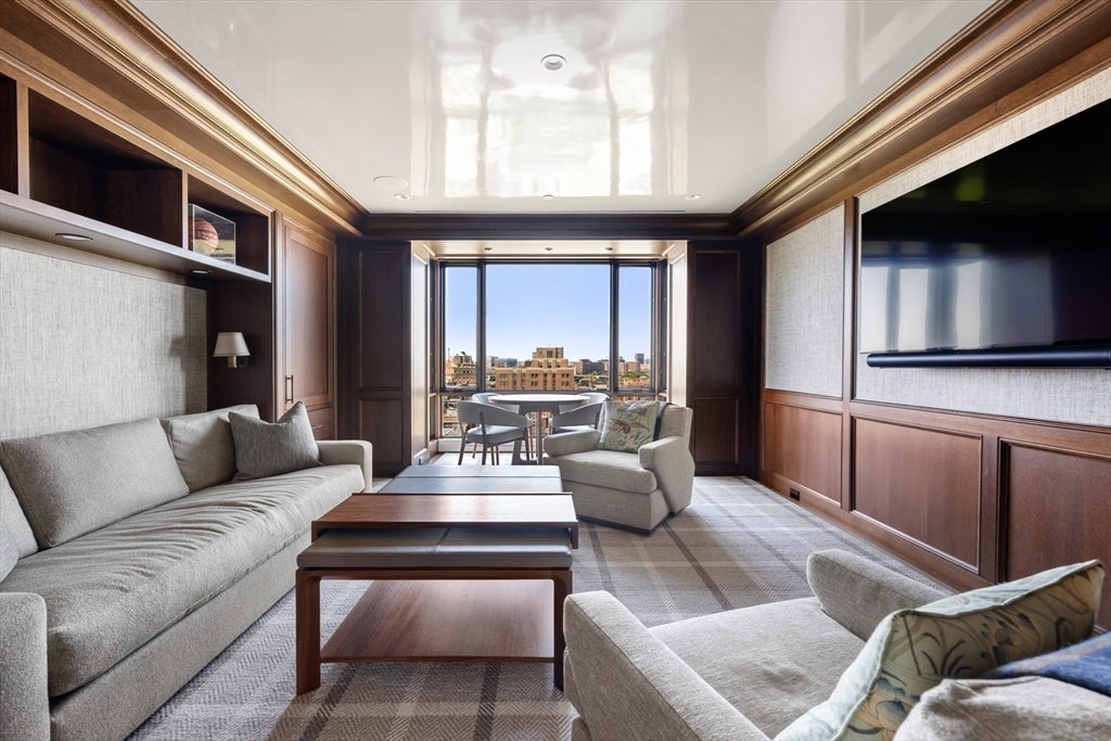 2 Commonwealth Avenue, Unit 11BCD Boston, MA 02116 - Photo 25 of 39 a living room with furniture and a large window