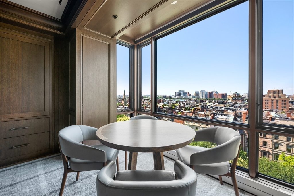 2 Commonwealth Avenue, Unit 11BCD Boston, MA 02116 - Photo 26 of 39 a balcony with a table and chairs