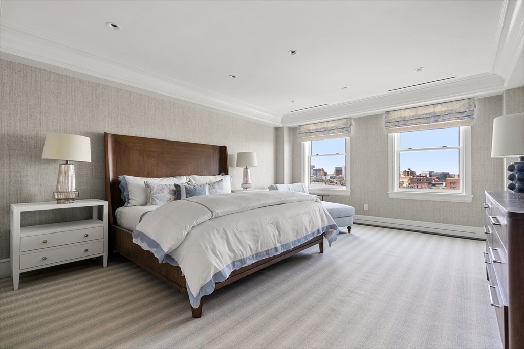 2 Commonwealth Avenue, Unit 11BCD Boston, MA 02116 - Photo 30 of 39 a bedroom with a bed and a window