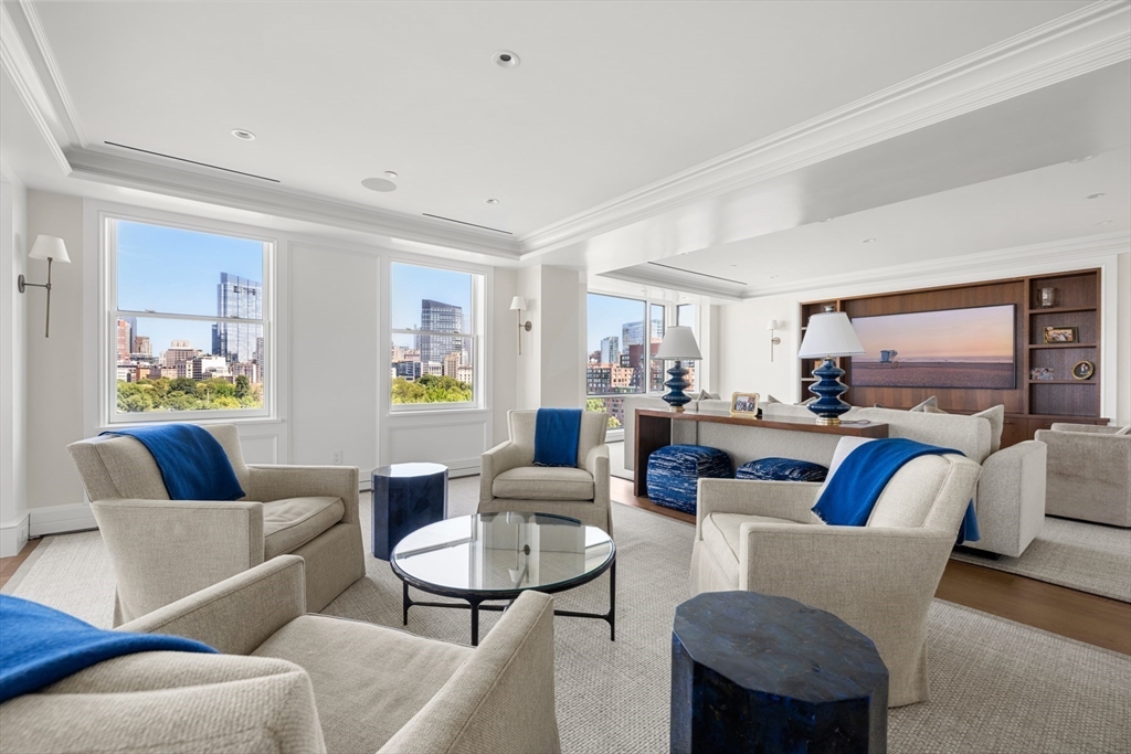 2 Commonwealth Avenue, Unit 11BCD Boston, MA 02116 - Photo 3 of 39 a living room with furniture and a large window