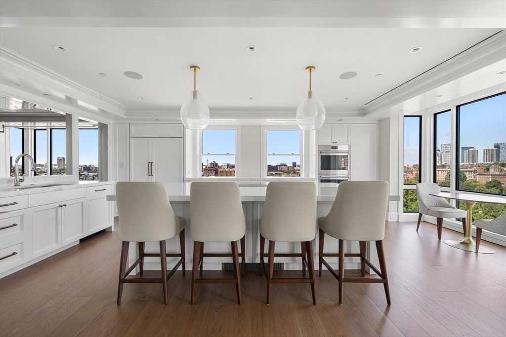 2 Commonwealth Avenue, Unit 11BCD Boston, MA 02116 - Photo 8 of 39 a dining room with furniture window and wooden floor