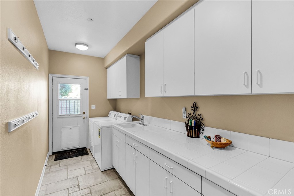 2542 Adage Way Riverside, CA 92506 - Photo 24 of 59 a view of a storage and utility room with closet washing machine