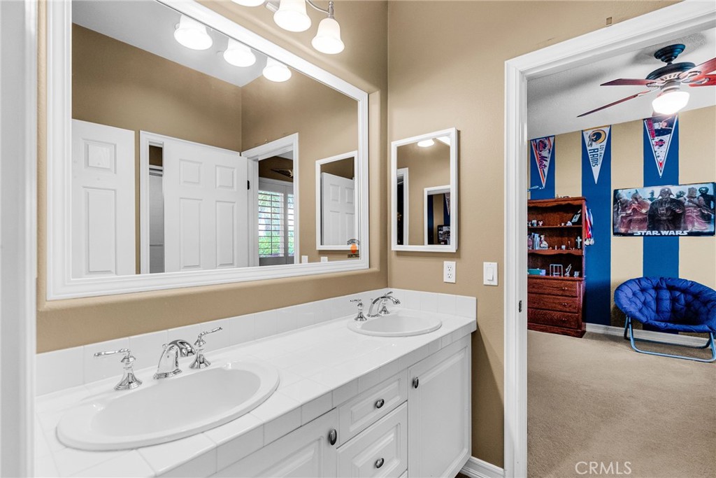 2542 Adage Way Riverside, CA 92506 - Photo 34 of 59 a spacious bathroom with a double vanity sink and a mirror