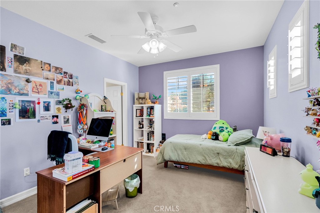 2542 Adage Way Riverside, CA 92506 - Photo 35 of 59 a bedroom with a bed furniture and a window
