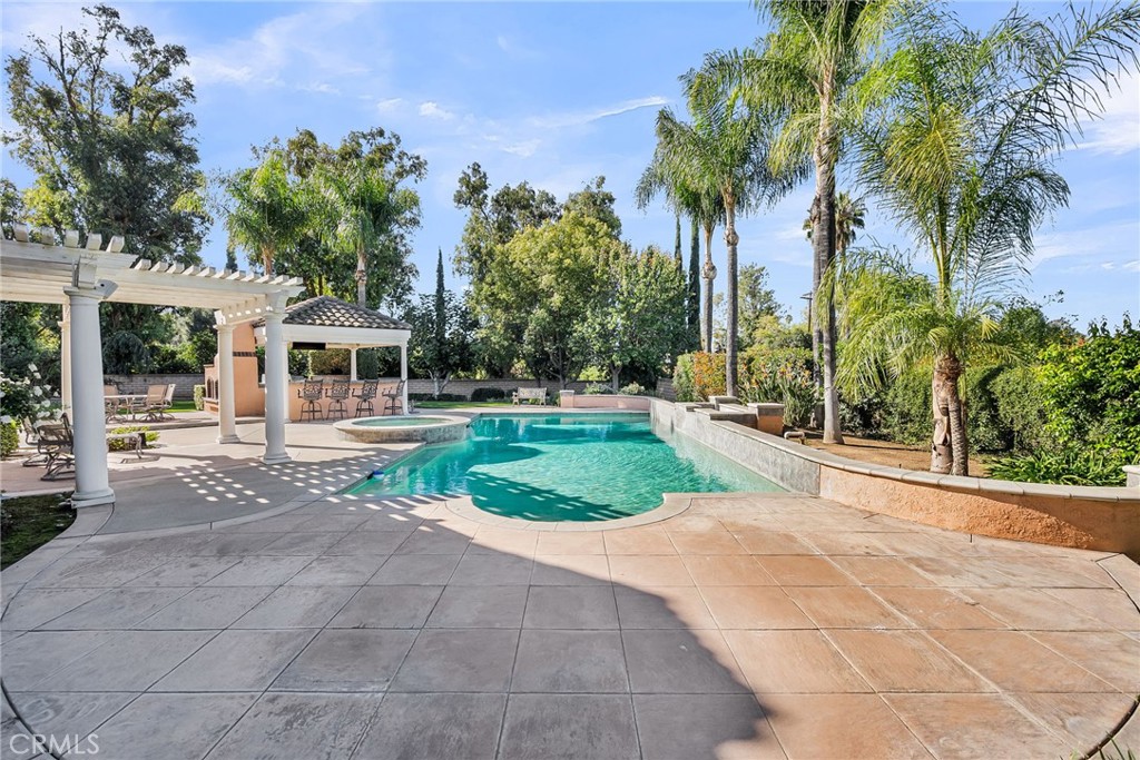 2542 Adage Way Riverside, CA 92506 - Photo 41 of 59 a house with palm tree in front of it