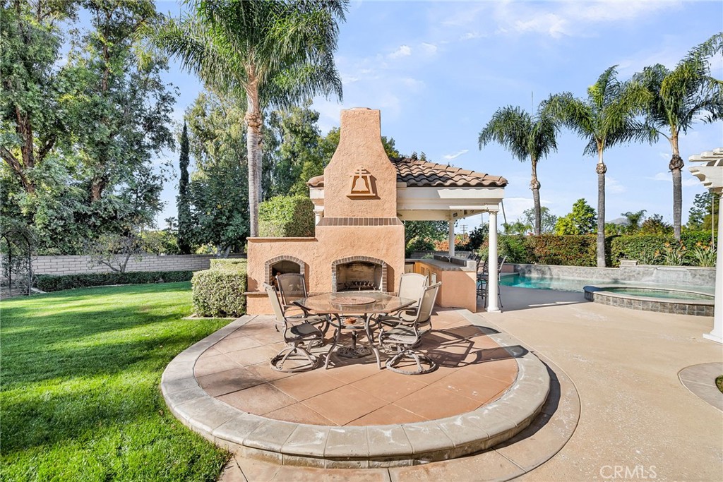 2542 Adage Way Riverside, CA 92506 - Photo 45 of 59 a view of a house with a swimming pool and a small yard
