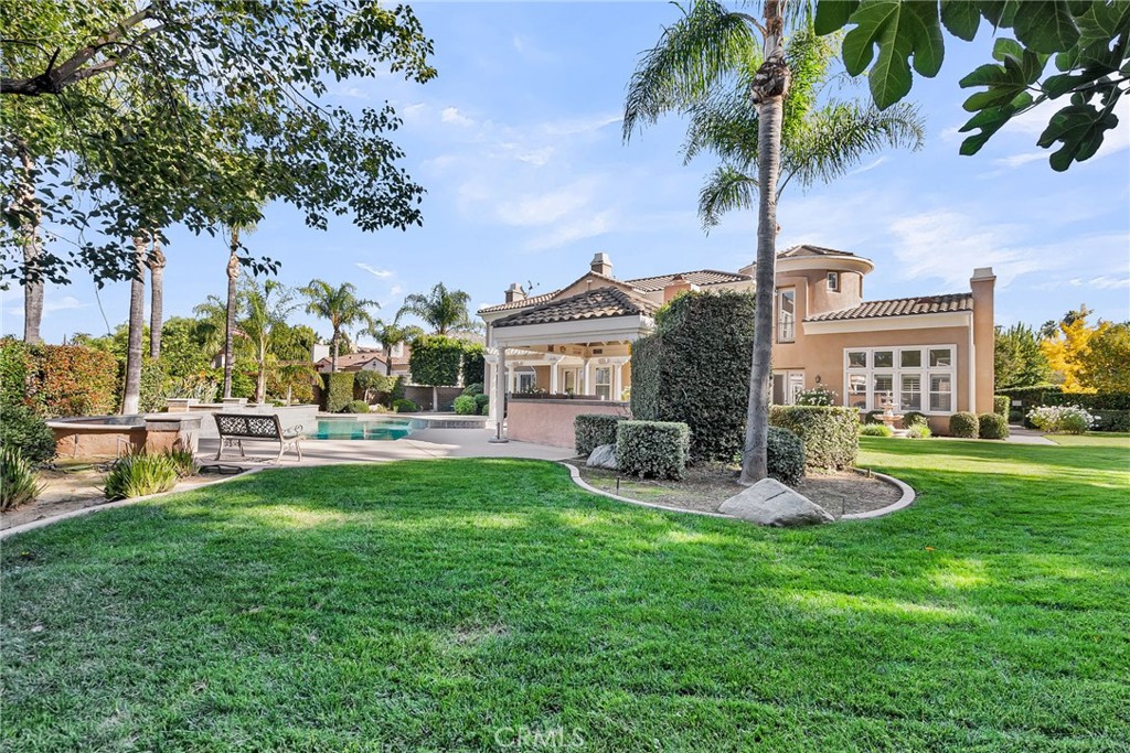 2542 Adage Way Riverside, CA 92506 - Photo 47 of 59 a front view of a house with garden and sitting area