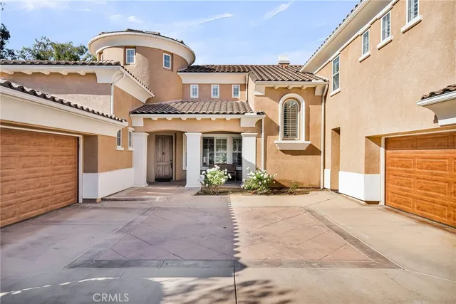 a view of a hallway with two windows and a fireplace