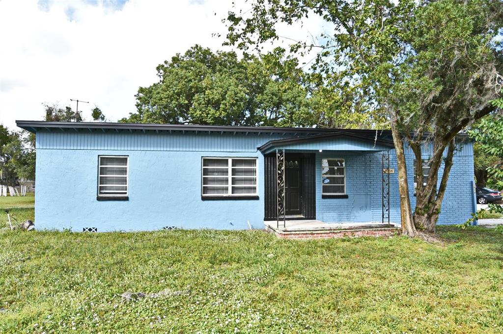 1934 Rouse Road Orlando, FL 32817 - Photo 1 of 1 a front view of a house with garden